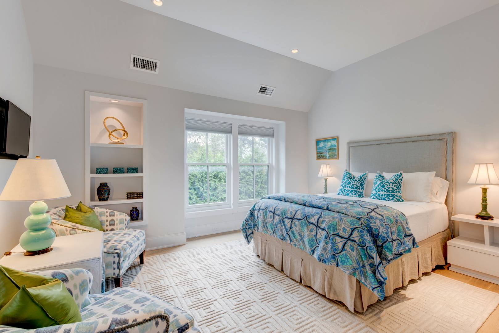 83 School Street Bridgehampton, NY 11932 - Photo 14 of 19 a bed sitting in a bedroom next to a window with lamp