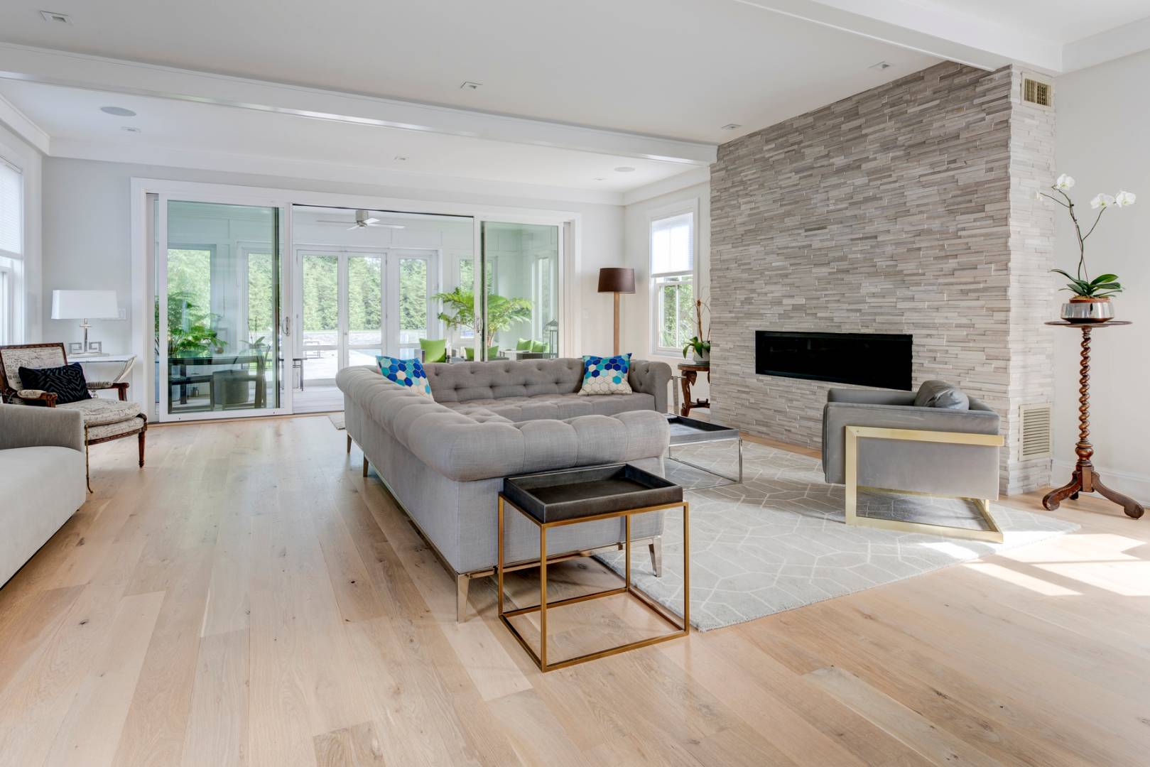 83 School Street Bridgehampton, NY 11932 - Photo 6 of 19 a living room with furniture and a fireplace