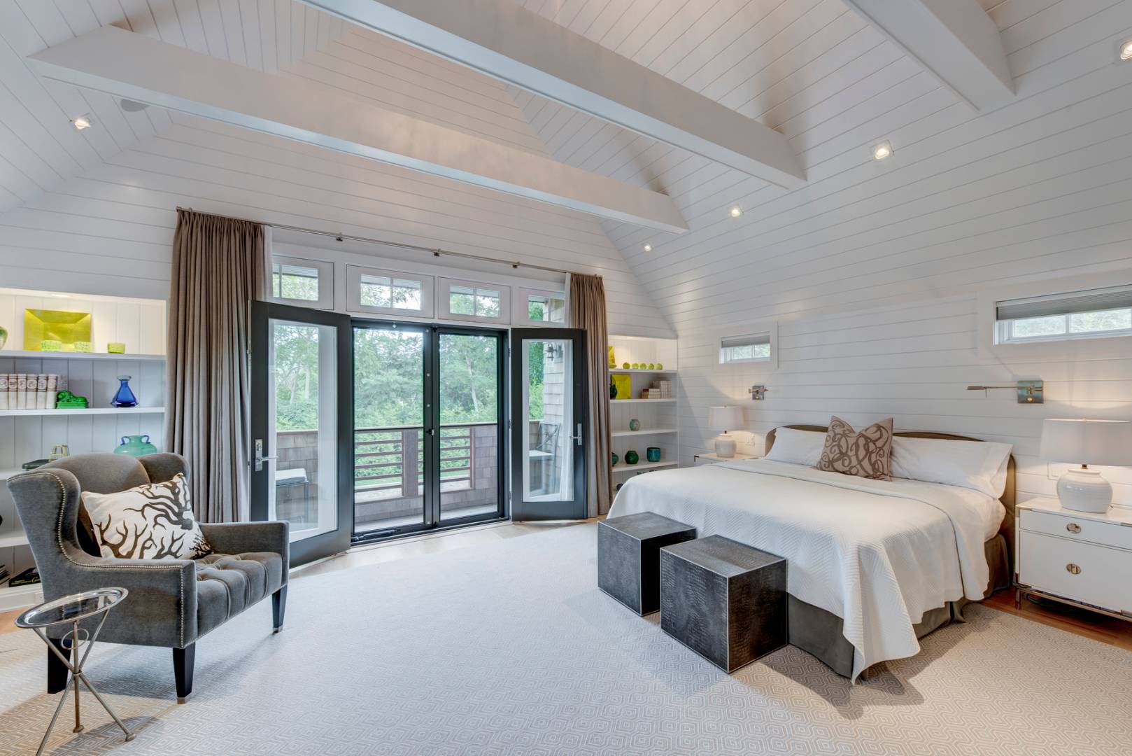 83 School Street Bridgehampton, NY 11932 - Photo 10 of 19 a bedroom with a bed and a couch