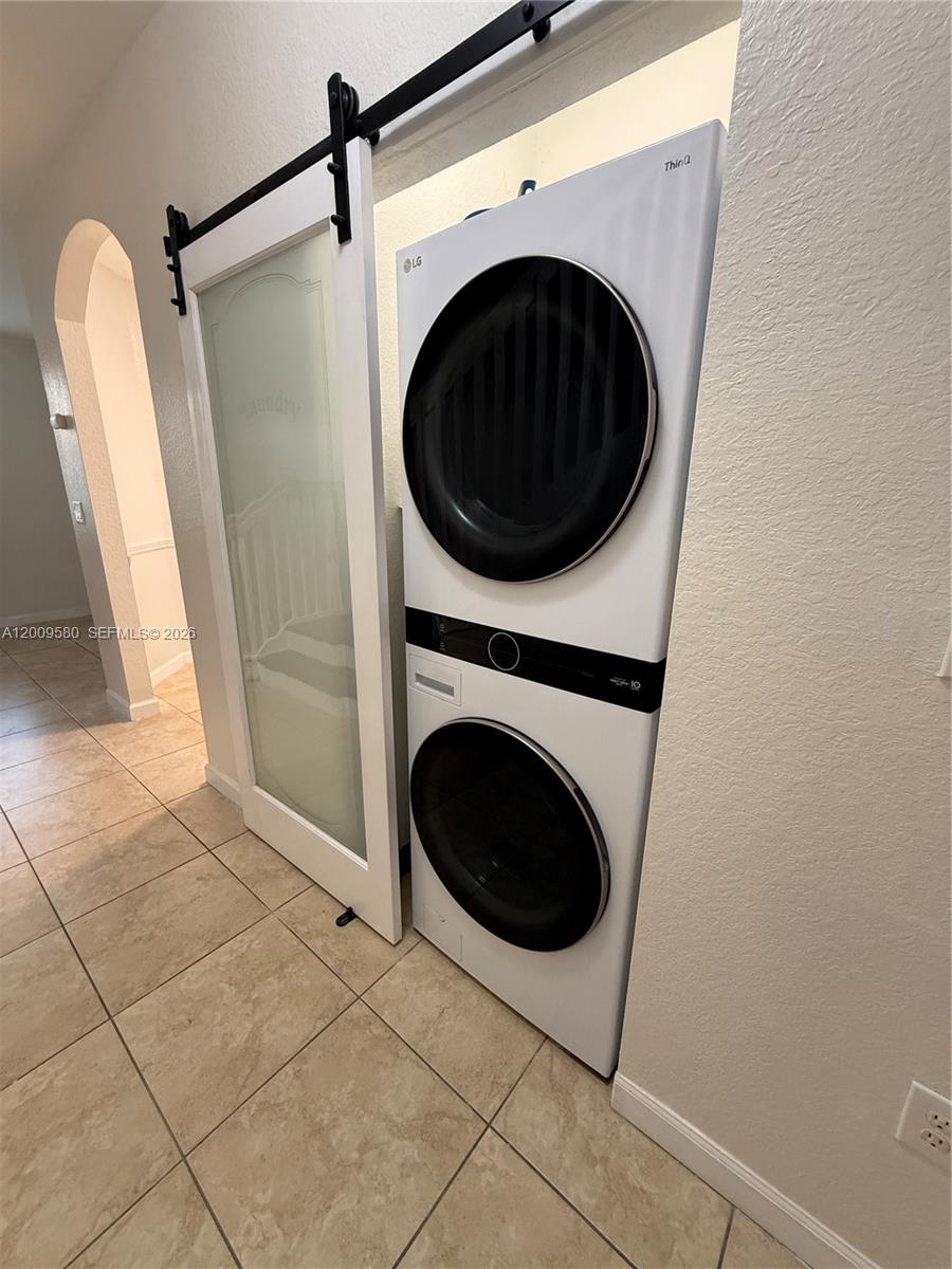 9239 Southwest 227th Street, Unit 1 Cutler Bay, FL 33190 - Photo 11 of 39 a utility room with dryer and washer