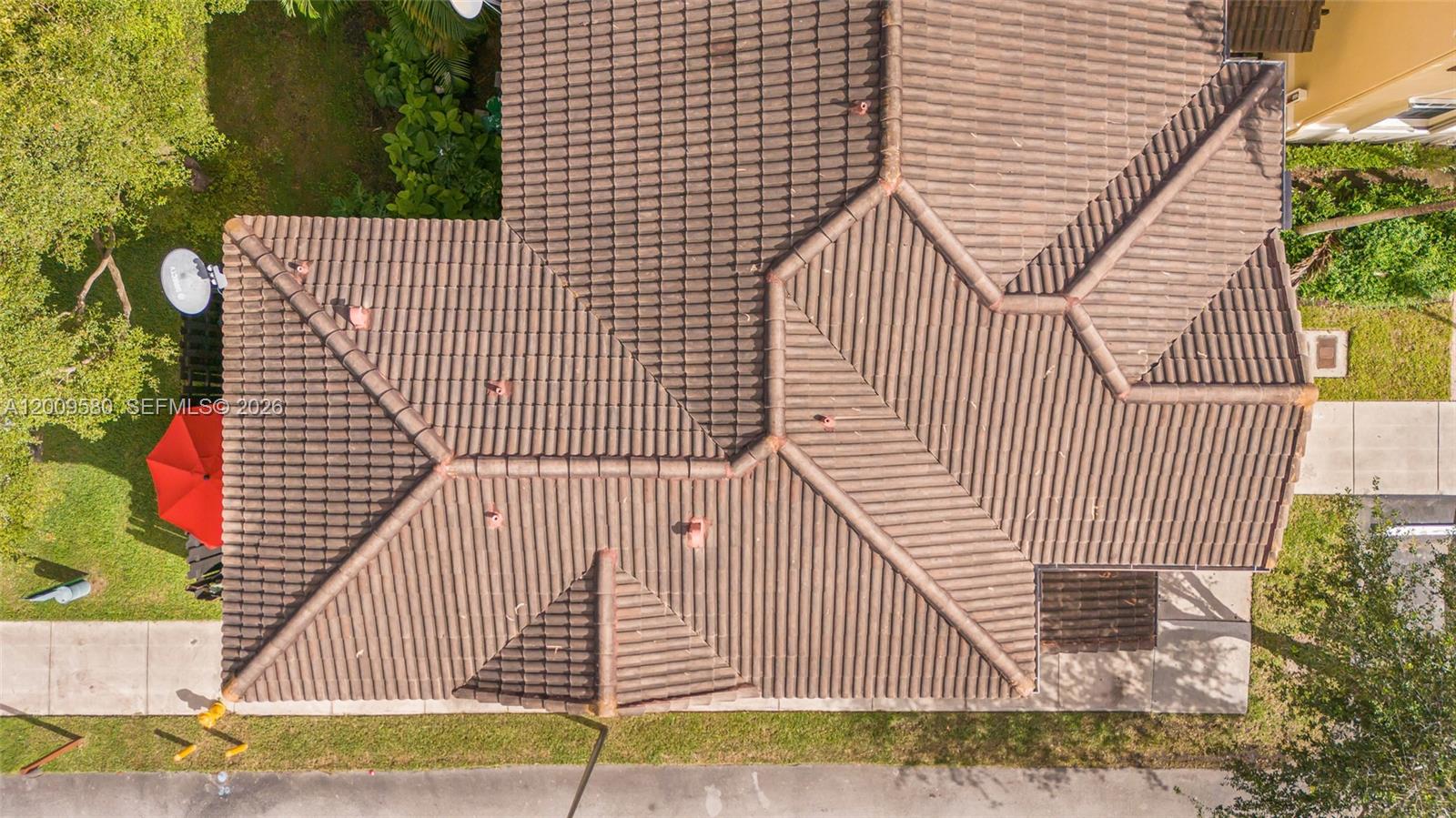 9239 Southwest 227th Street, Unit 1 Cutler Bay, FL 33190 - Photo 31 of 39 a view of a brick house with many windows