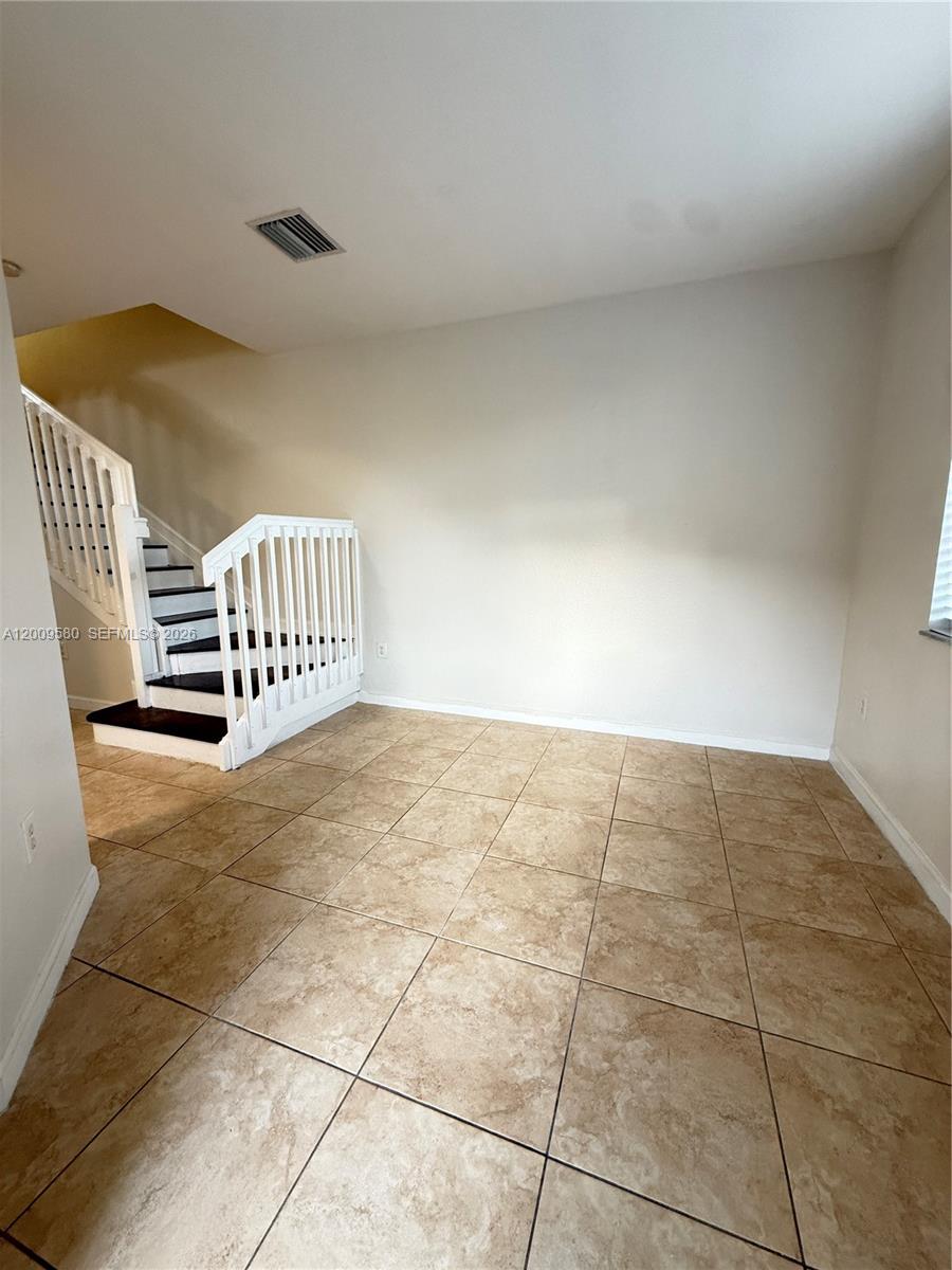 9239 Southwest 227th Street, Unit 1 Cutler Bay, FL 33190 - Photo 5 of 39 a view of an empty room and has a sink