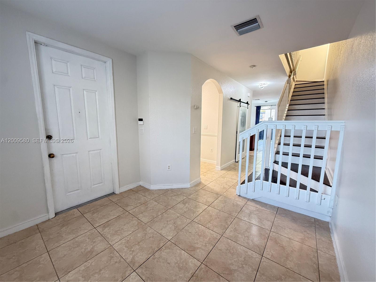 9239 Southwest 227th Street, Unit 1 Cutler Bay, FL 33190 - Photo 6 of 39 a view of front door with entryway