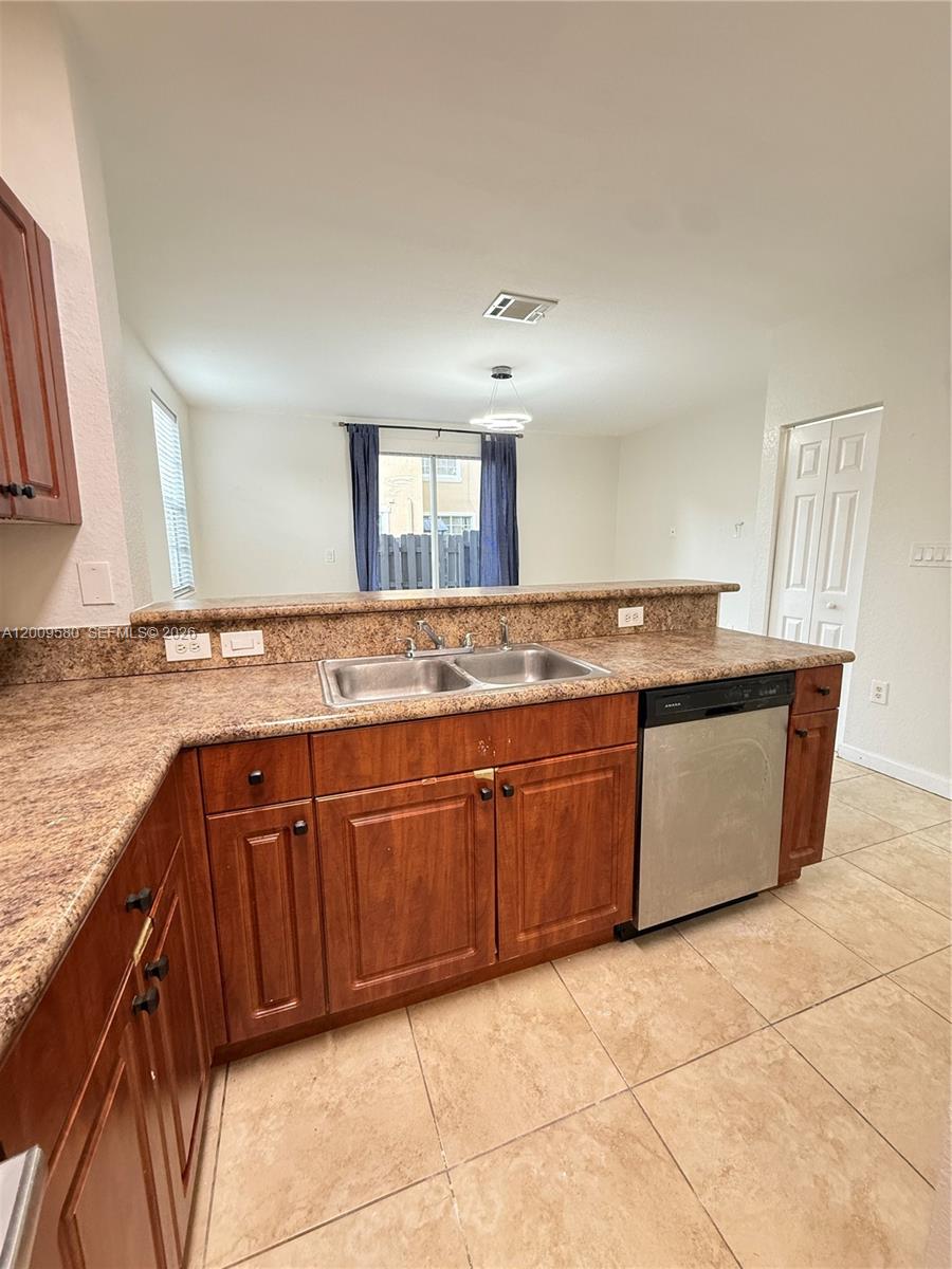 9239 Southwest 227th Street, Unit 1 Cutler Bay, FL 33190 - Photo 8 of 39 a bathroom with a granite countertop sink and a mirror
