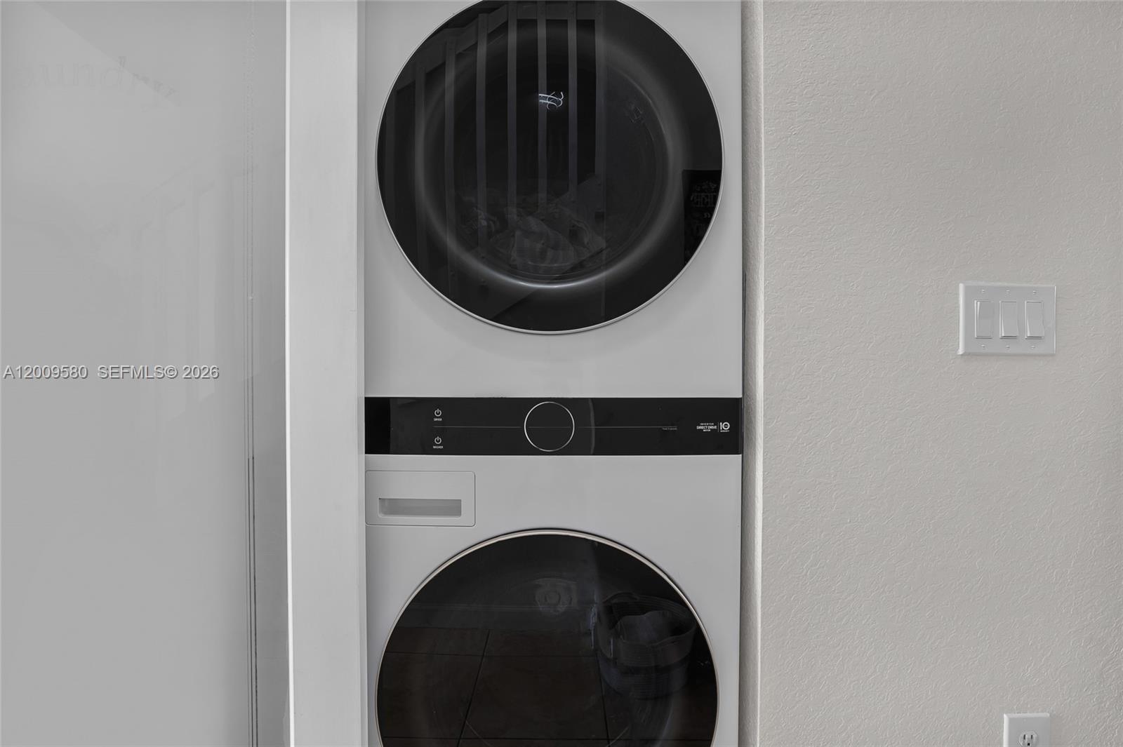 9239 Southwest 227th Street, Unit 1 Cutler Bay, FL 33190 - Photo 10 of 39 a close up view of a washer and dryer