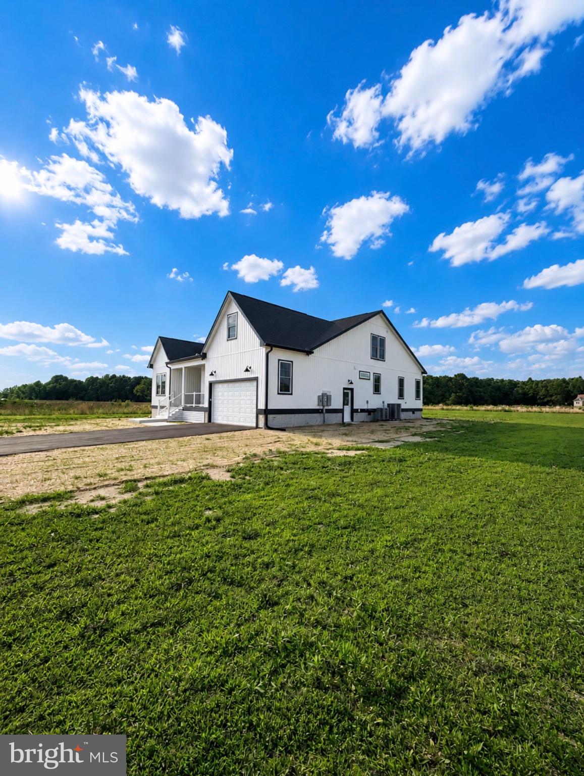 21963 Hardscrabble Road Georgetown, DE 19947 - Photo 43 of 43 Charming home under a bright sky.