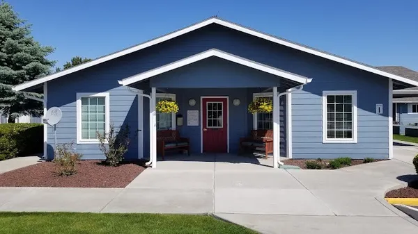 a front view of a house with yard