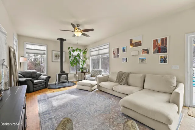 a living room with furniture or couch and a large window