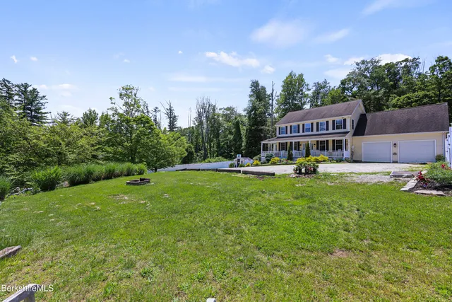 an aerial view of a house with a garden