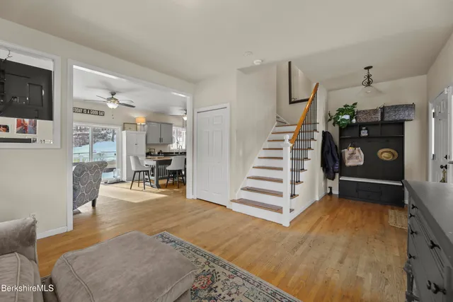 a view of a livingroom with furniture and staircase