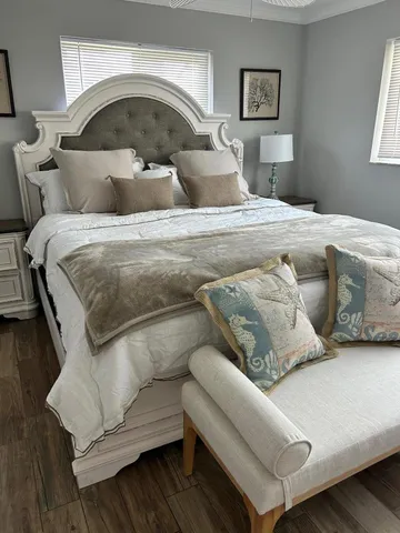 a bedroom with a bed and a couch