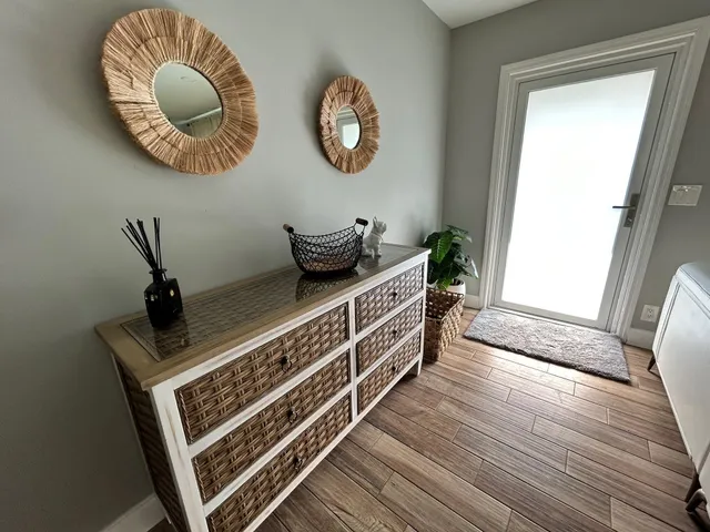 a view of a livingroom with furniture and wooden floor