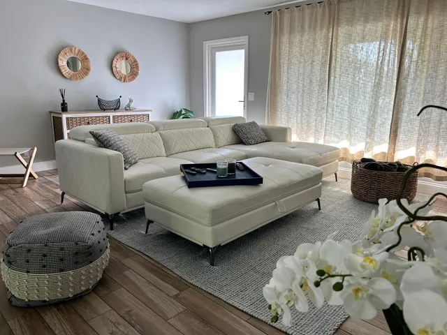 a living room with furniture and a window