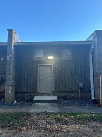 a view of a street with a building in the background