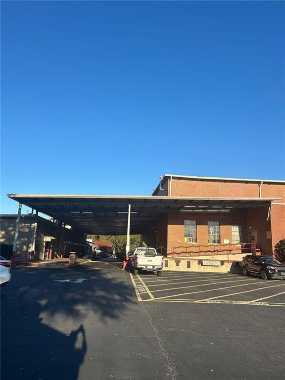 601 South Madison Avenue Monroe, GA 30655 - Photo 2 of 14 a view of a car park from a ceiling room