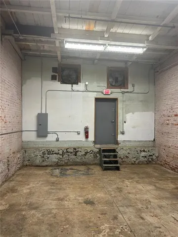 a view of kitchen with cabinets