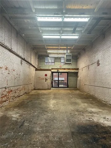 a view of a bathroom with a sink and a mirror