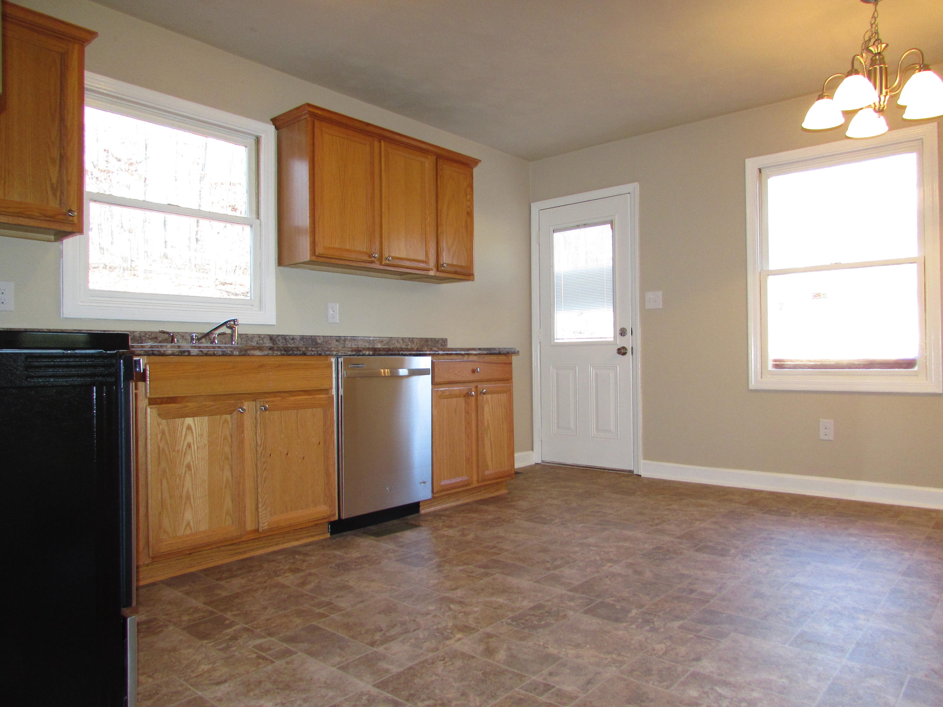 819 Blue Ridge Drive Blue Ridge, VA 24064 - Photo 4 of 15 an empty room with windows and cabinet