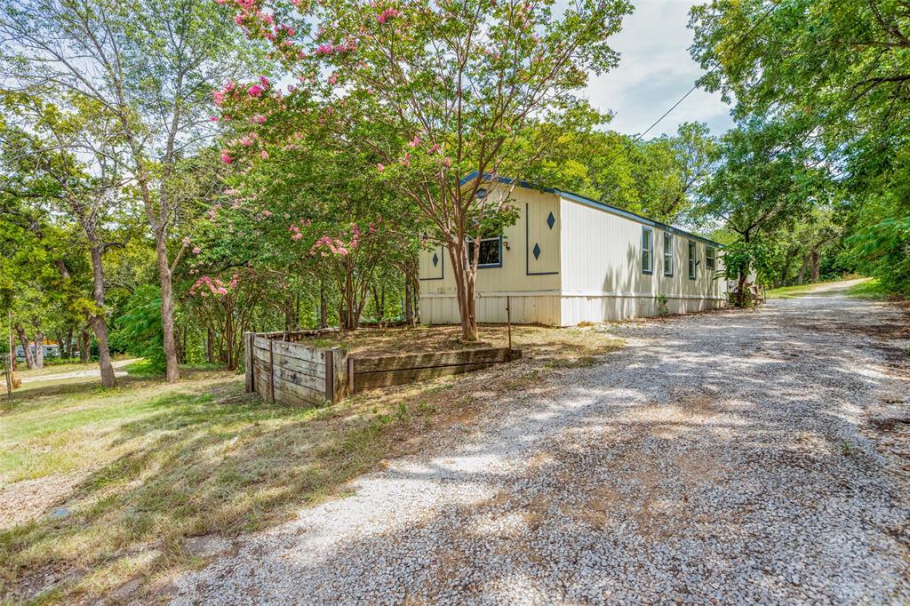 28 Wembley Road Gordonville, TX 76245 - Photo 1 of 24 Front elevation with large crepe myrtles!