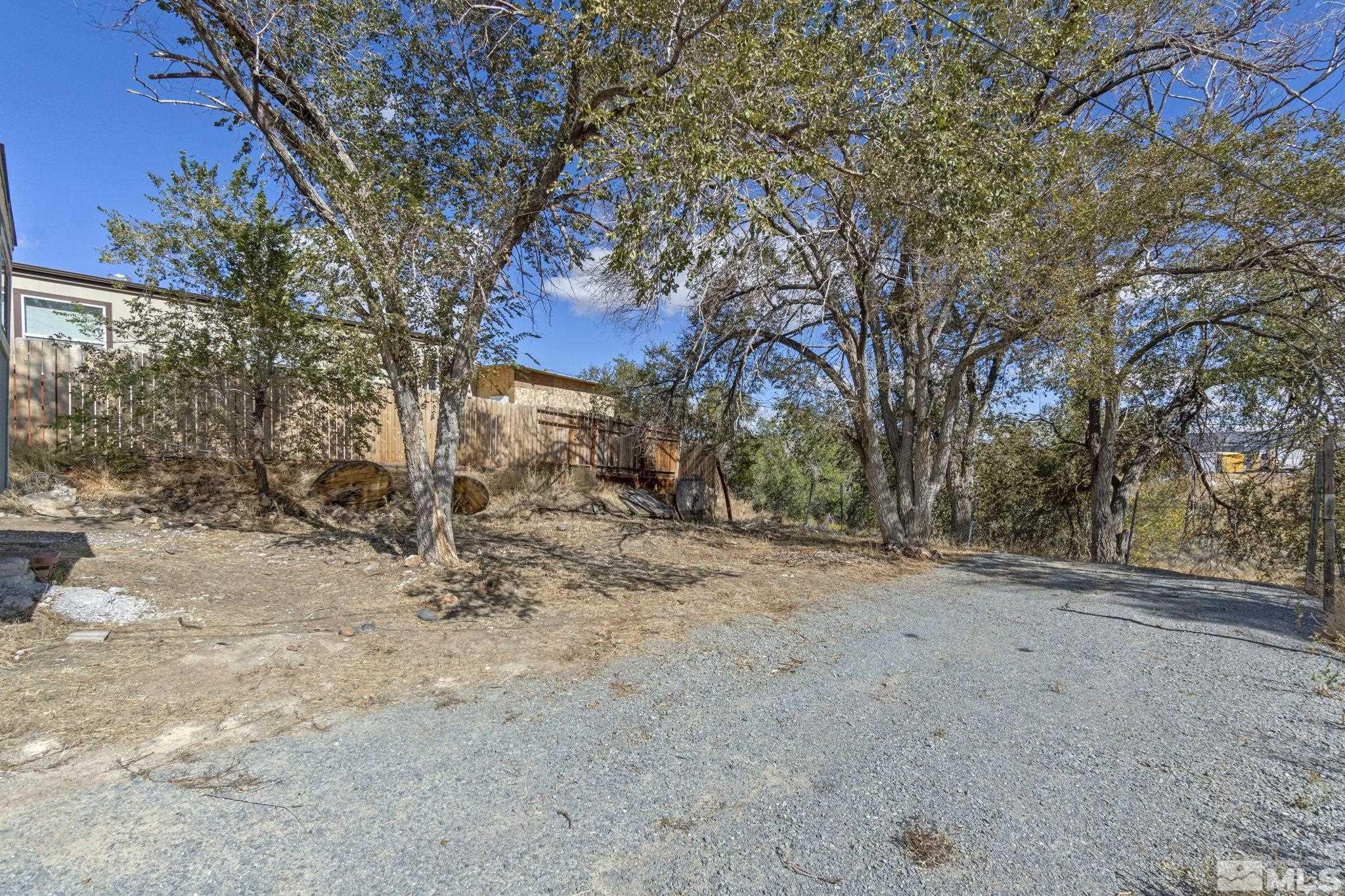 157 Walner Street Reno, NV 89506 - Photo 18 of 21 a view of a yard covered with snow in back
