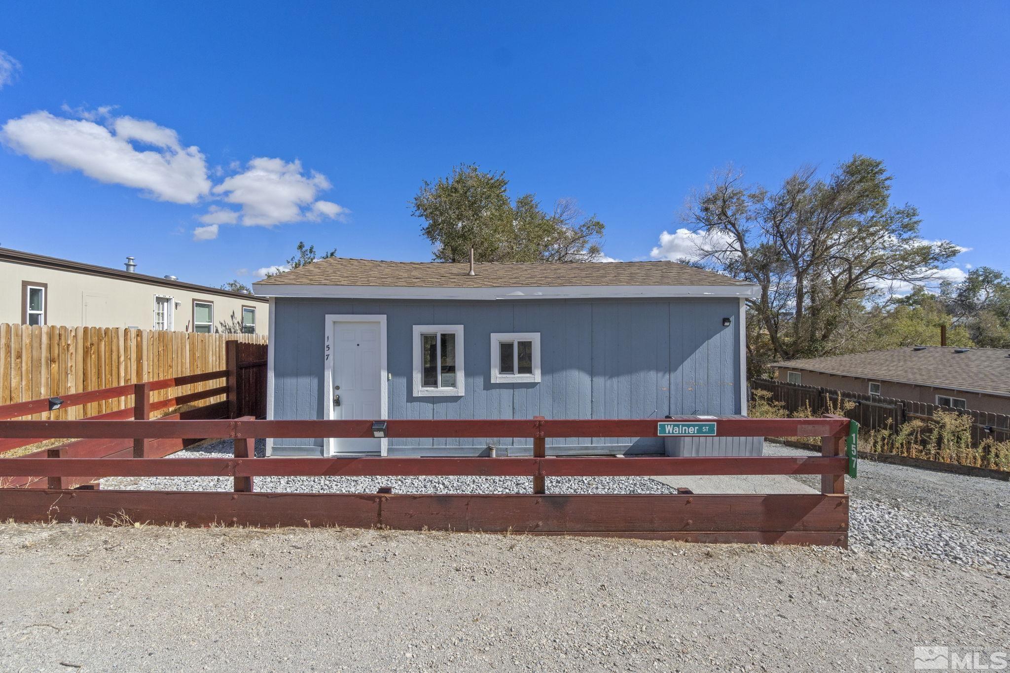 157 Walner Street Reno, NV 89506 - Photo 2 of 21 a backyard of a house with barbeque oven and outdoor seating
