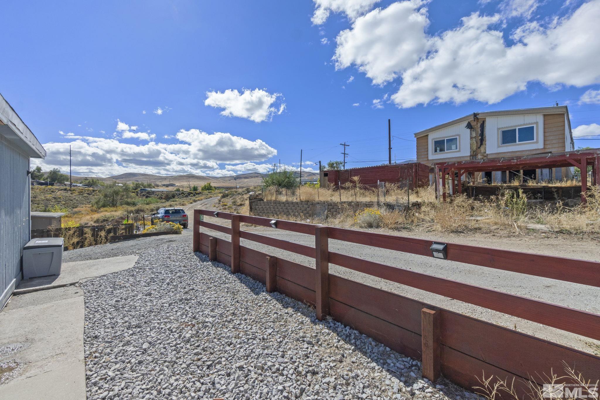 157 Walner Street Reno, NV 89506 - Photo 4 of 21 a view of a balcony with chair and wooden floor