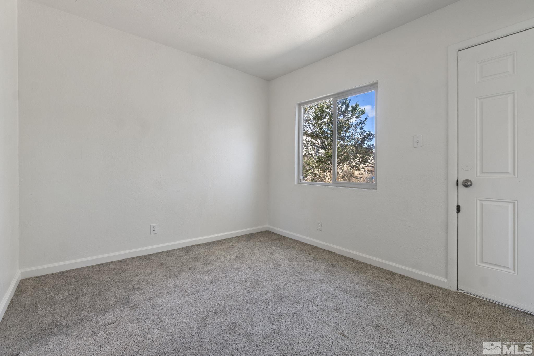 157 Walner Street Reno, NV 89506 - Photo 5 of 21 an empty room with a window