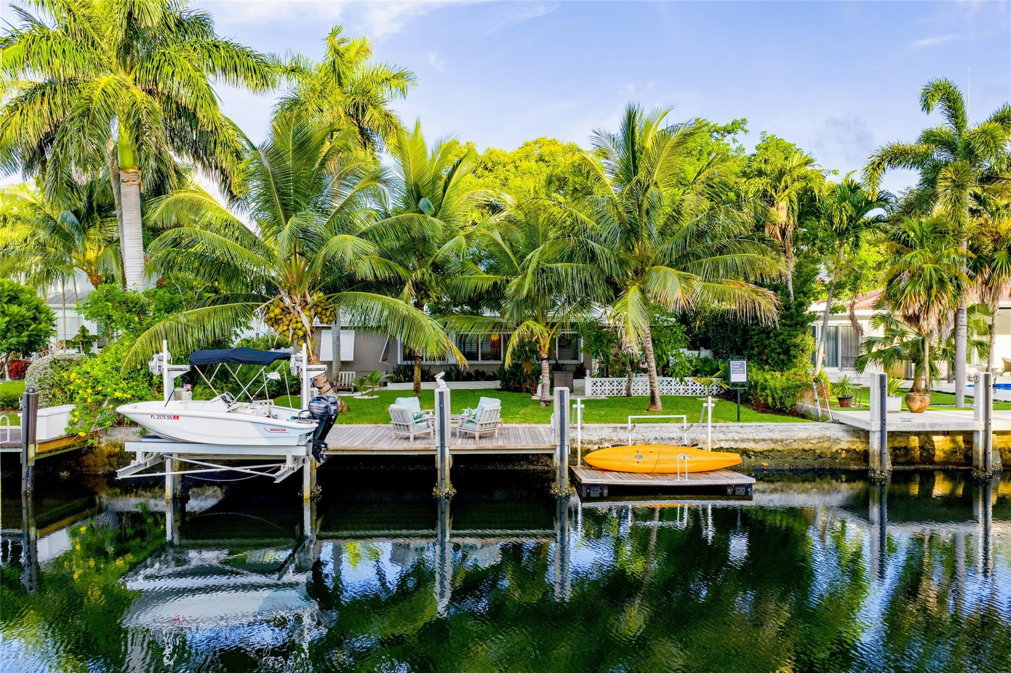 224 North Gordon Road Fort Lauderdale, FL 33301 - Photo 1 of 45 a view of swimming pool with lawn chairs and plants