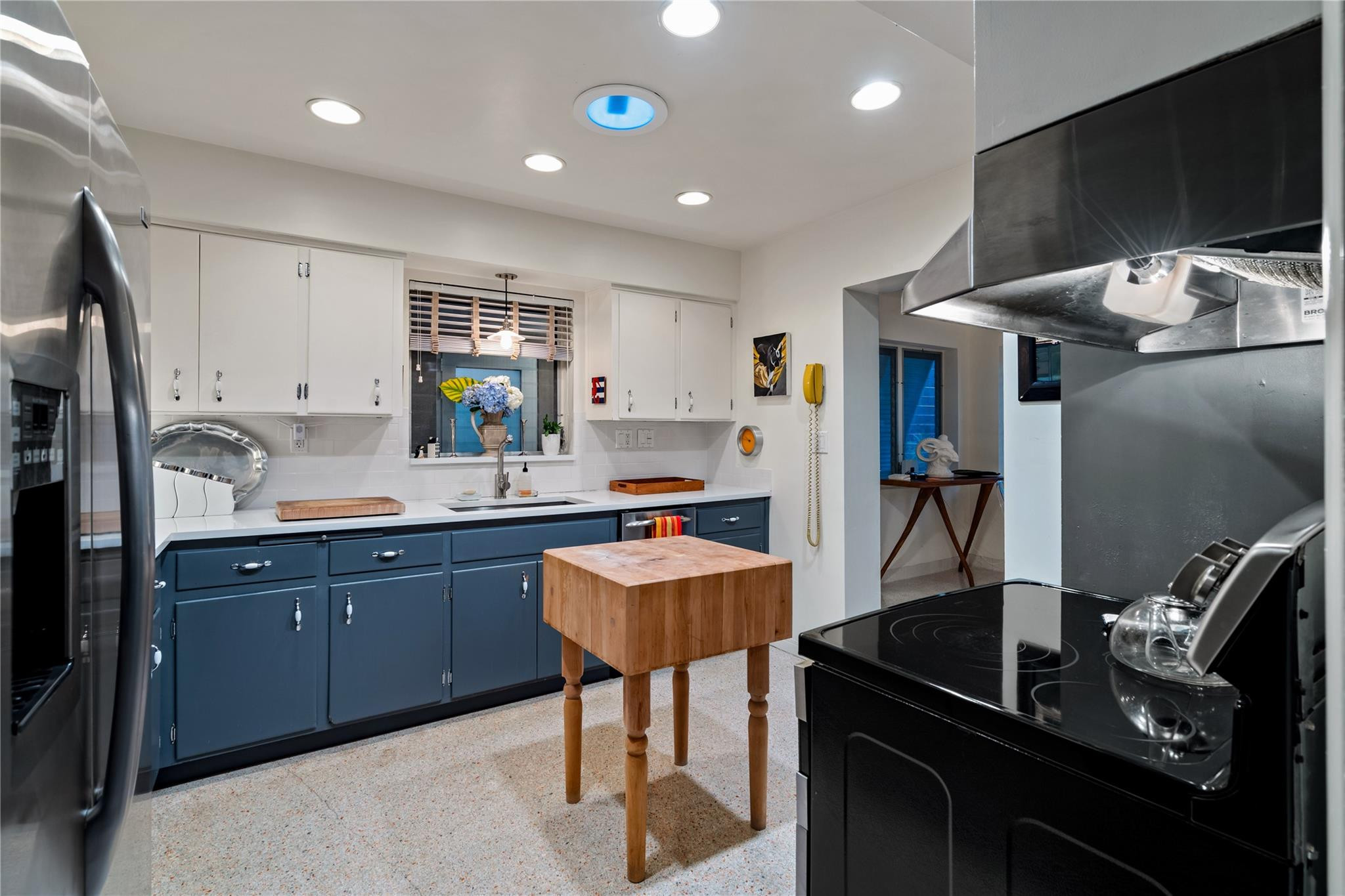 224 North Gordon Road Fort Lauderdale, FL 33301 - Photo 11 of 45 a kitchen with stainless steel appliances granite countertop sink stove and refrigerator