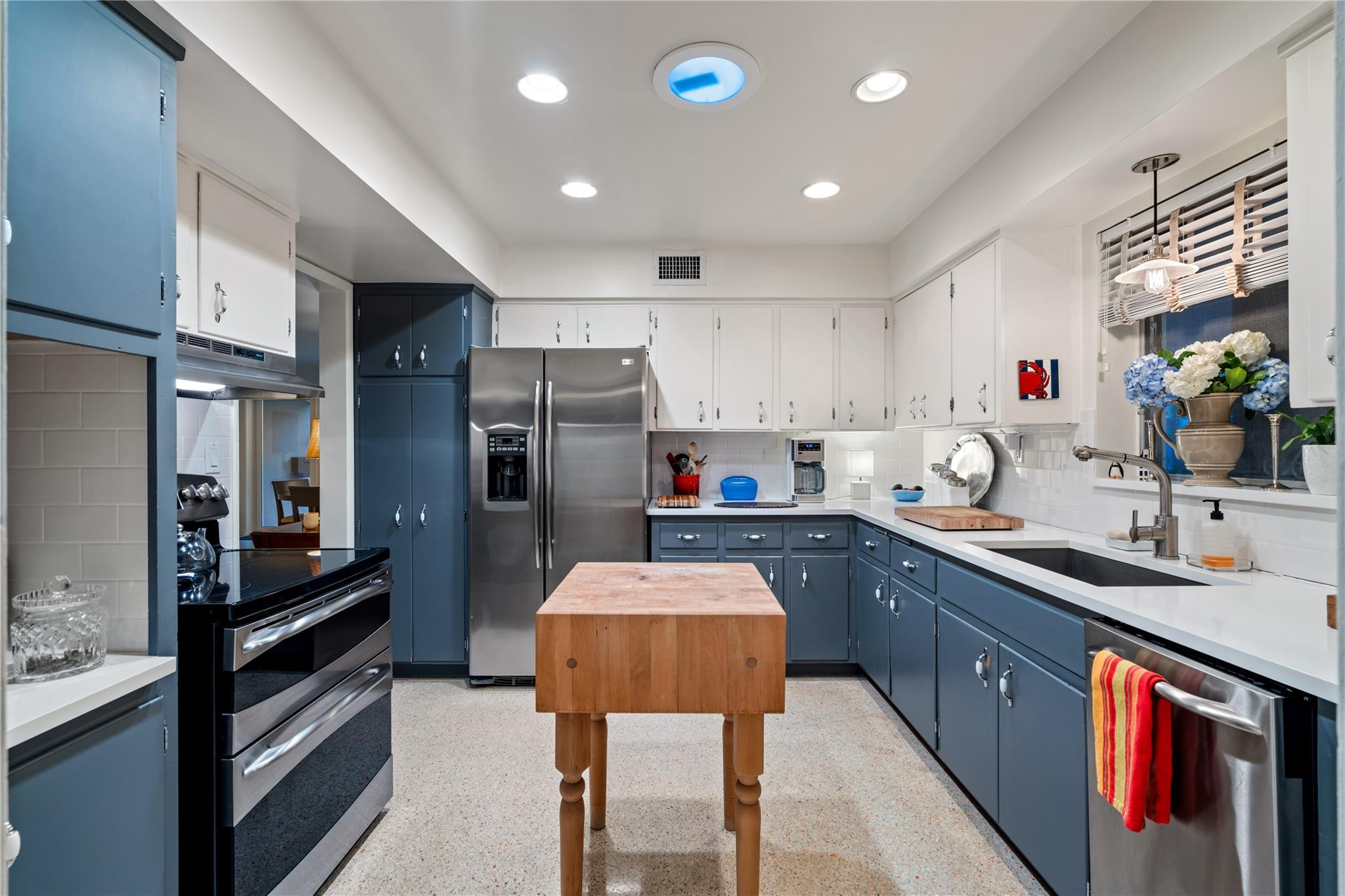 224 North Gordon Road Fort Lauderdale, FL 33301 - Photo 12 of 45 a kitchen with stainless steel appliances a sink stove and refrigerator