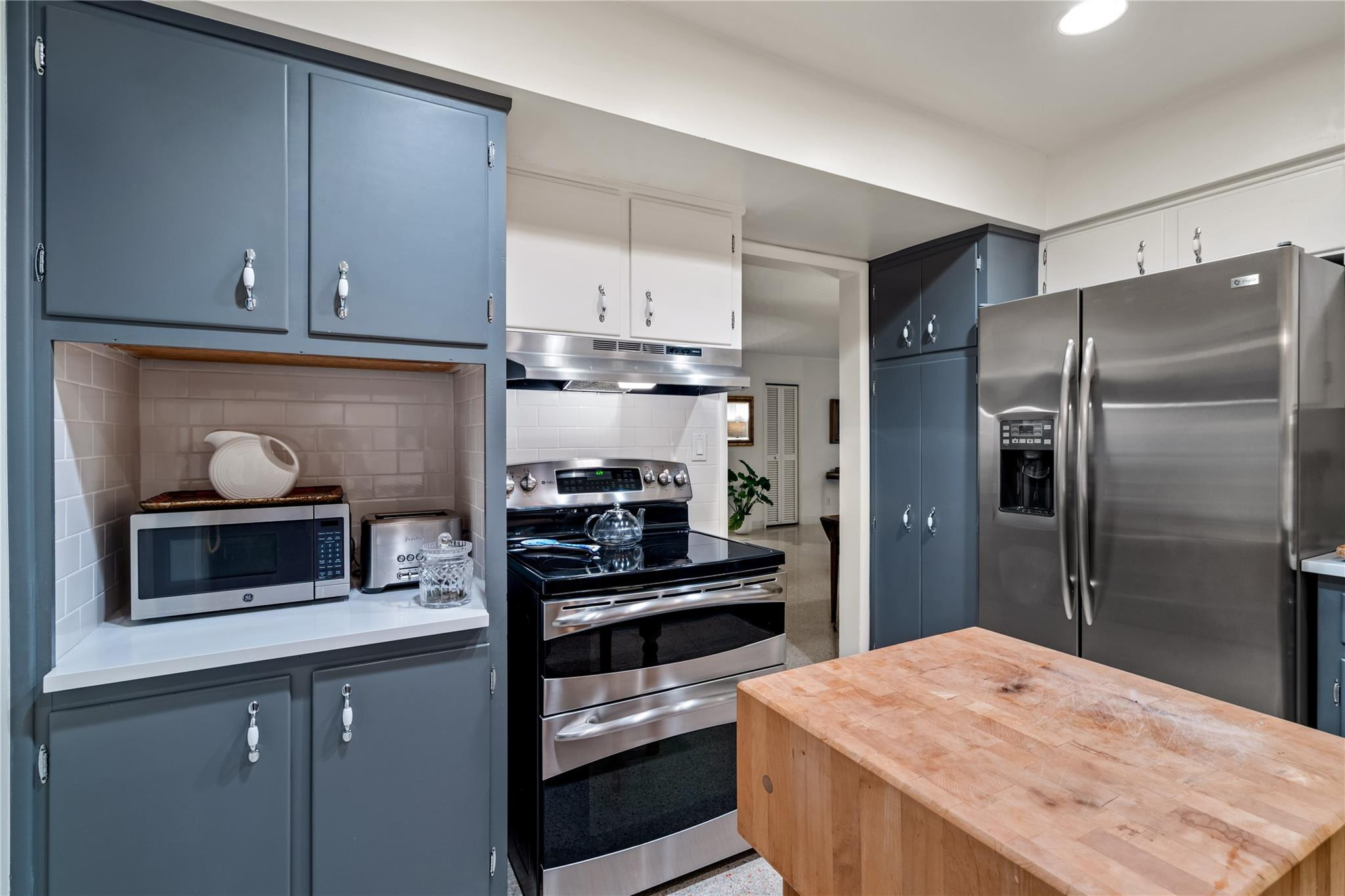 224 North Gordon Road Fort Lauderdale, FL 33301 - Photo 13 of 45 a kitchen with a refrigerator and microwave