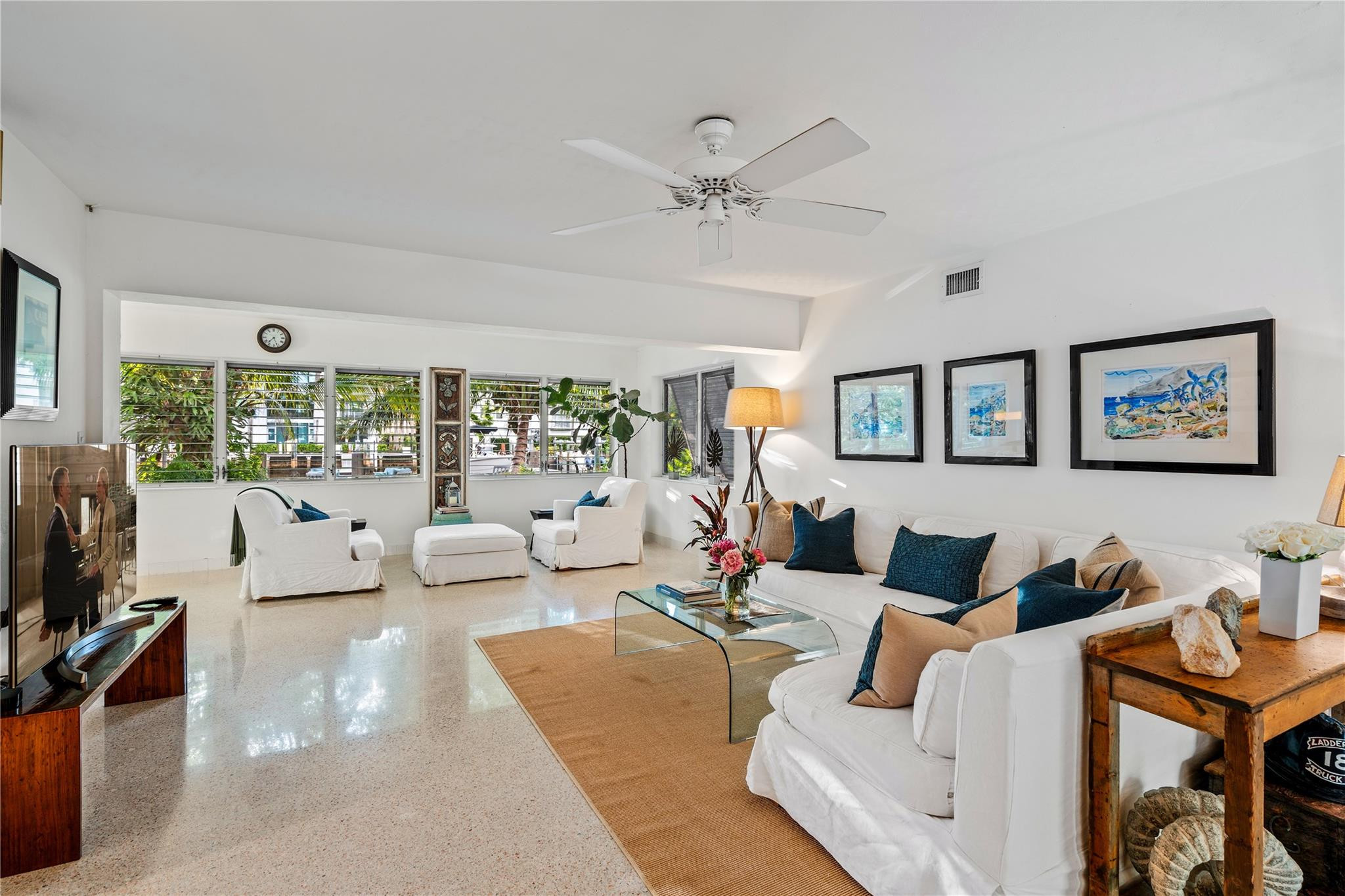 224 North Gordon Road Fort Lauderdale, FL 33301 - Photo 30 of 45 a living room with furniture ceiling fan and a flat screen tv