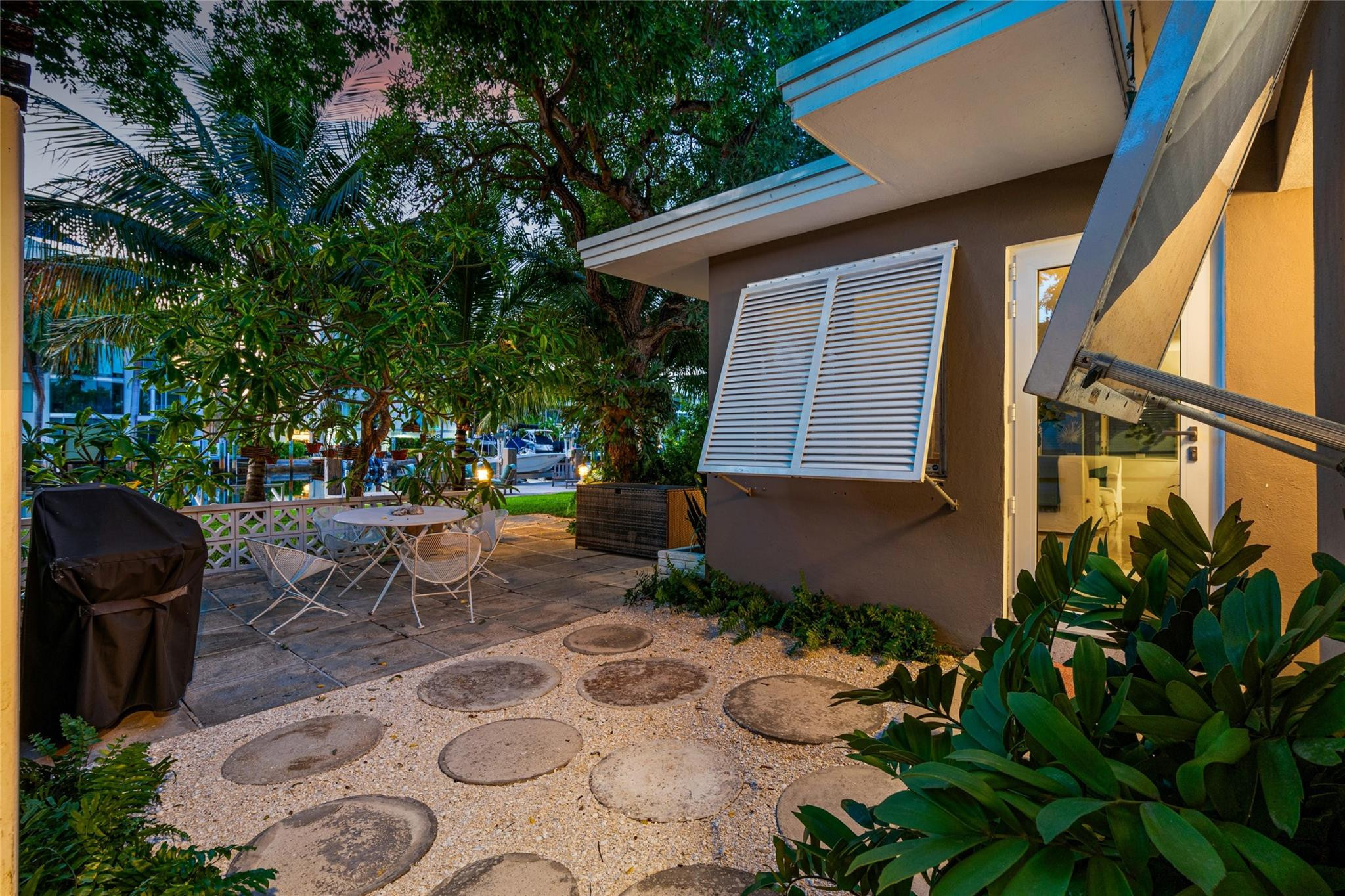 224 North Gordon Road Fort Lauderdale, FL 33301 - Photo 32 of 45 a backyard of a house with outdoor seating