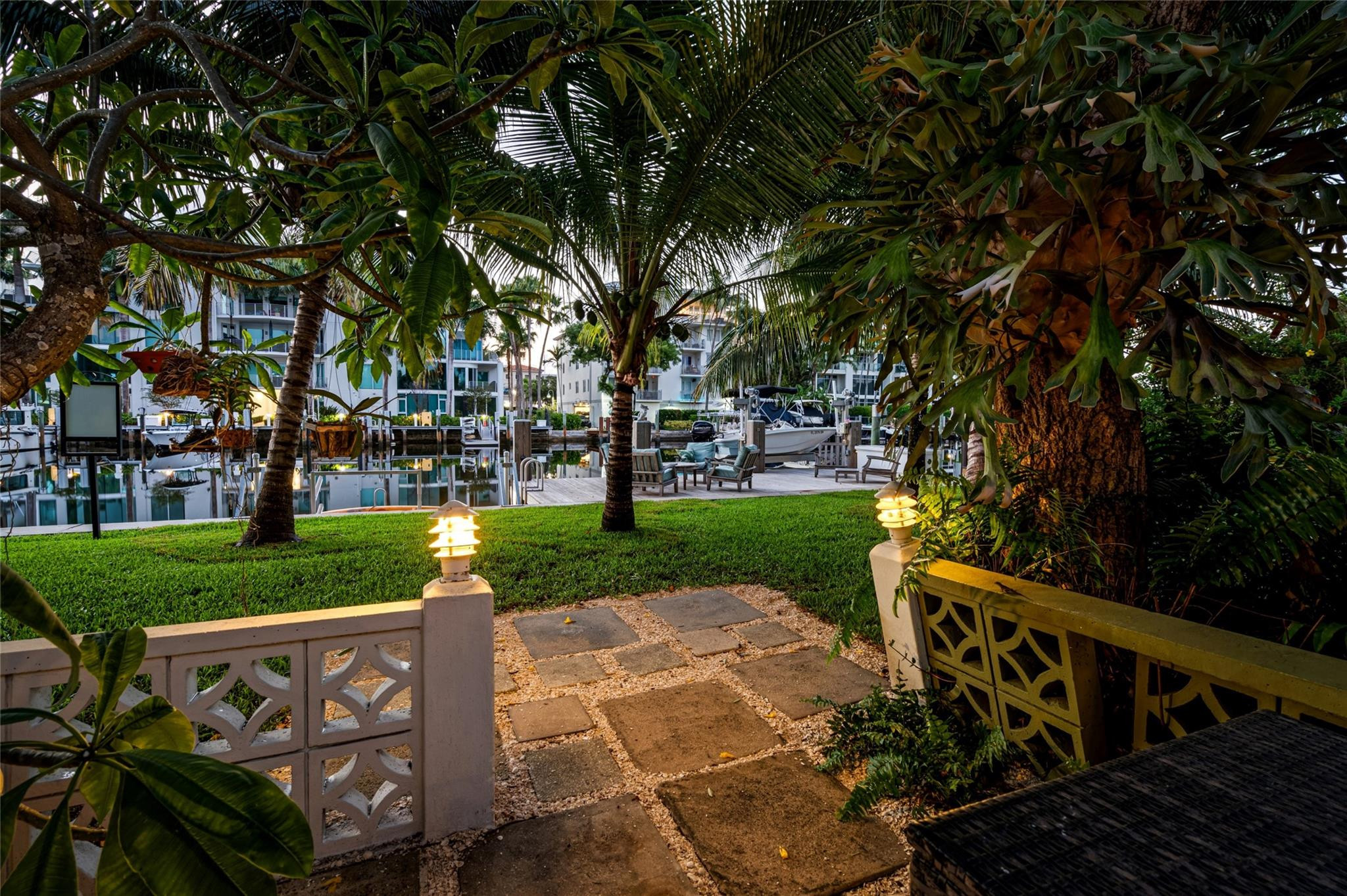 224 North Gordon Road Fort Lauderdale, FL 33301 - Photo 33 of 45 a view of a yard with plants and large trees