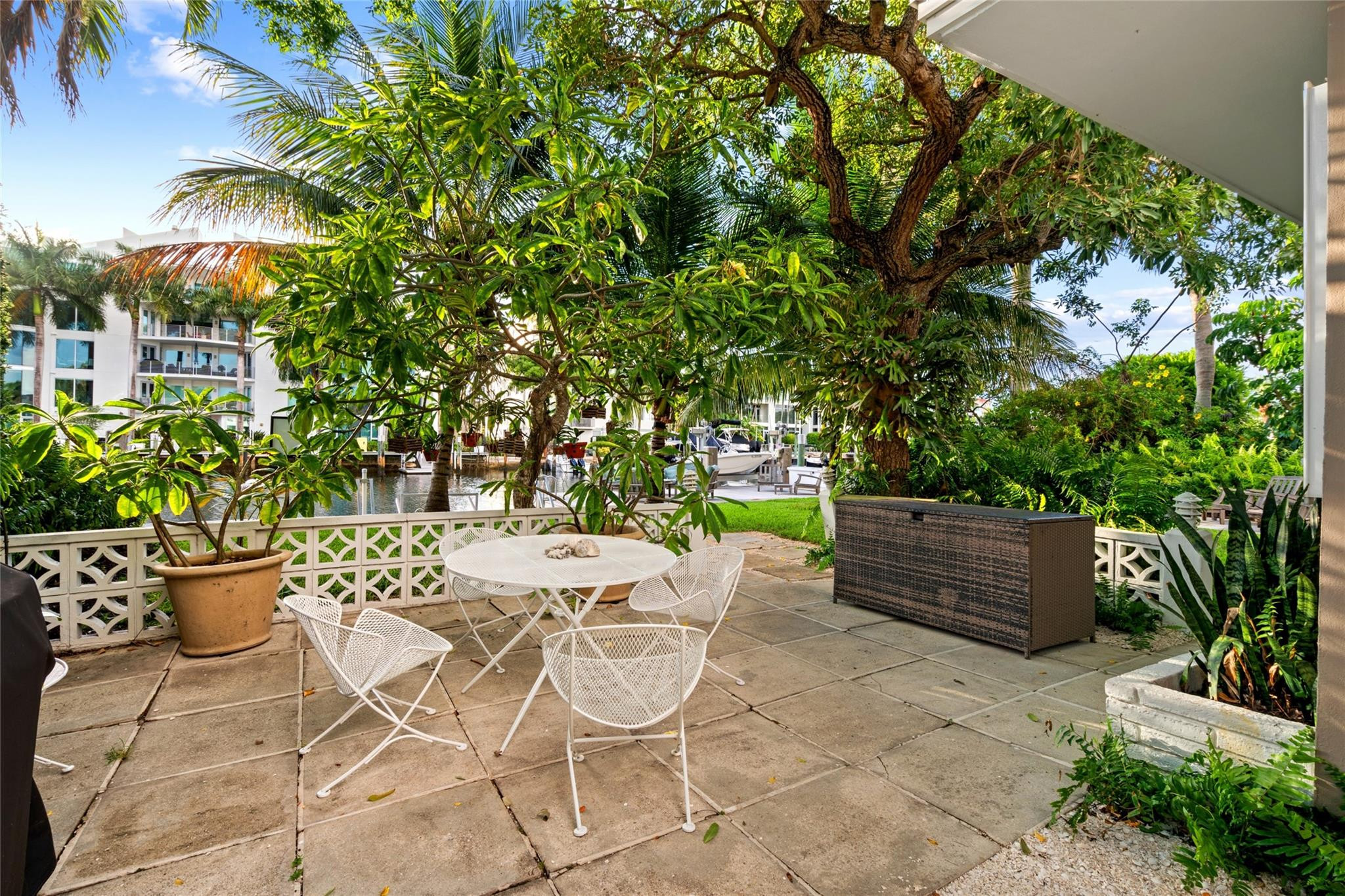 224 North Gordon Road Fort Lauderdale, FL 33301 - Photo 36 of 45 a view of a patio with table and chairs and potted plants