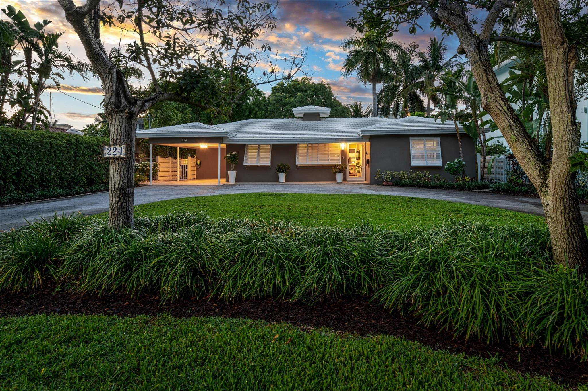 224 North Gordon Road Fort Lauderdale, FL 33301 - Photo 4 of 45 a front view of a house with yard and green space