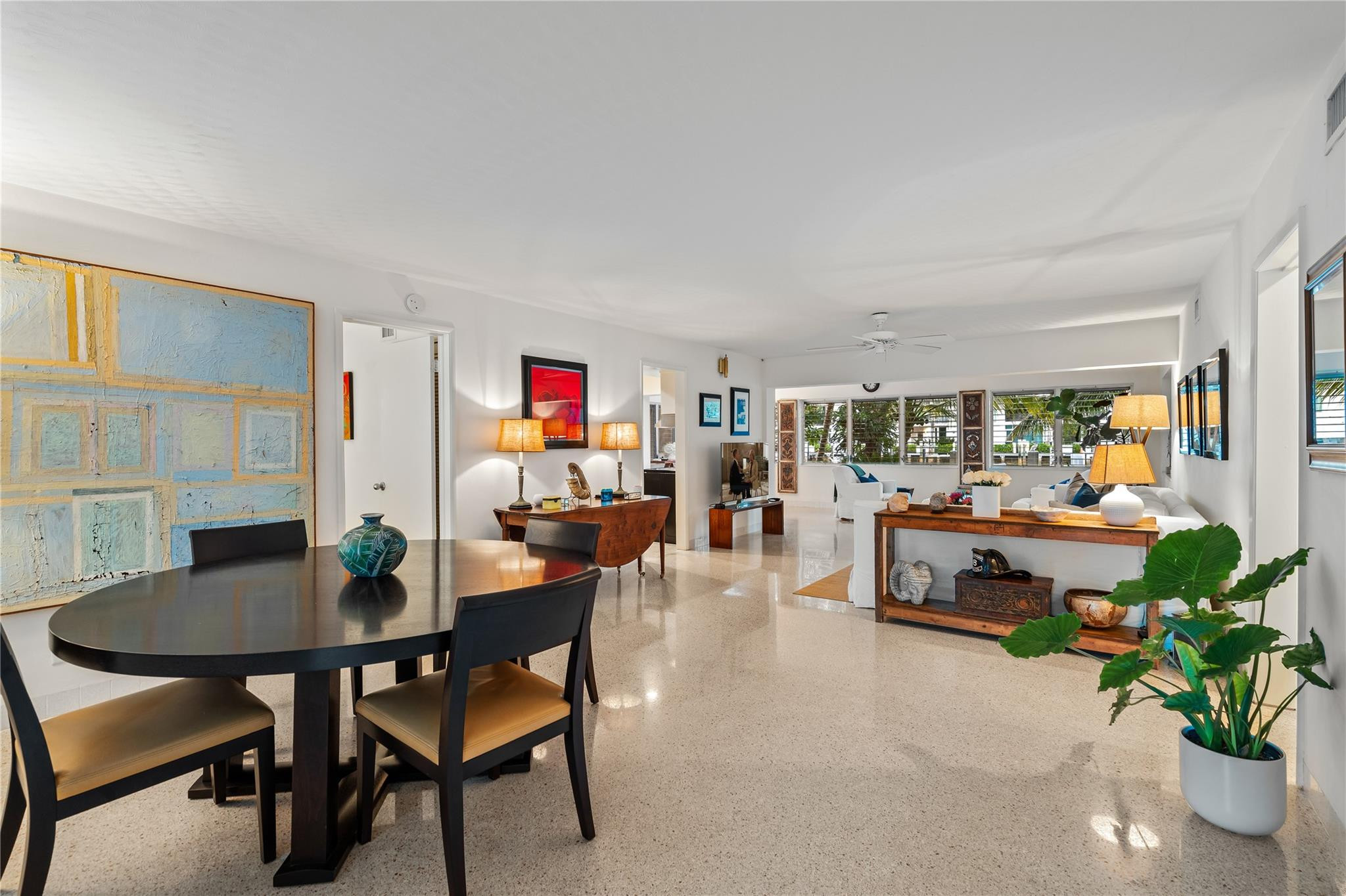 224 North Gordon Road Fort Lauderdale, FL 33301 - Photo 7 of 45 a dining room with furniture and a potted plant