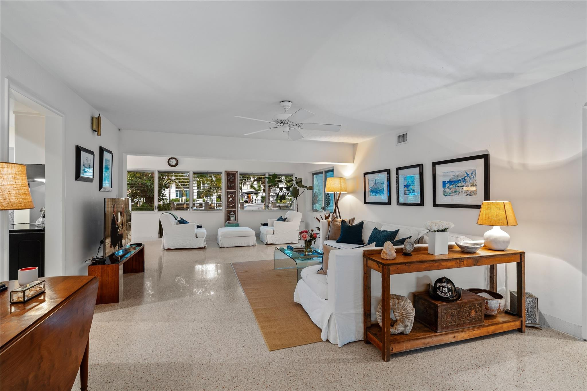 224 North Gordon Road Fort Lauderdale, FL 33301 - Photo 9 of 45 a living room with furniture and a flat screen tv