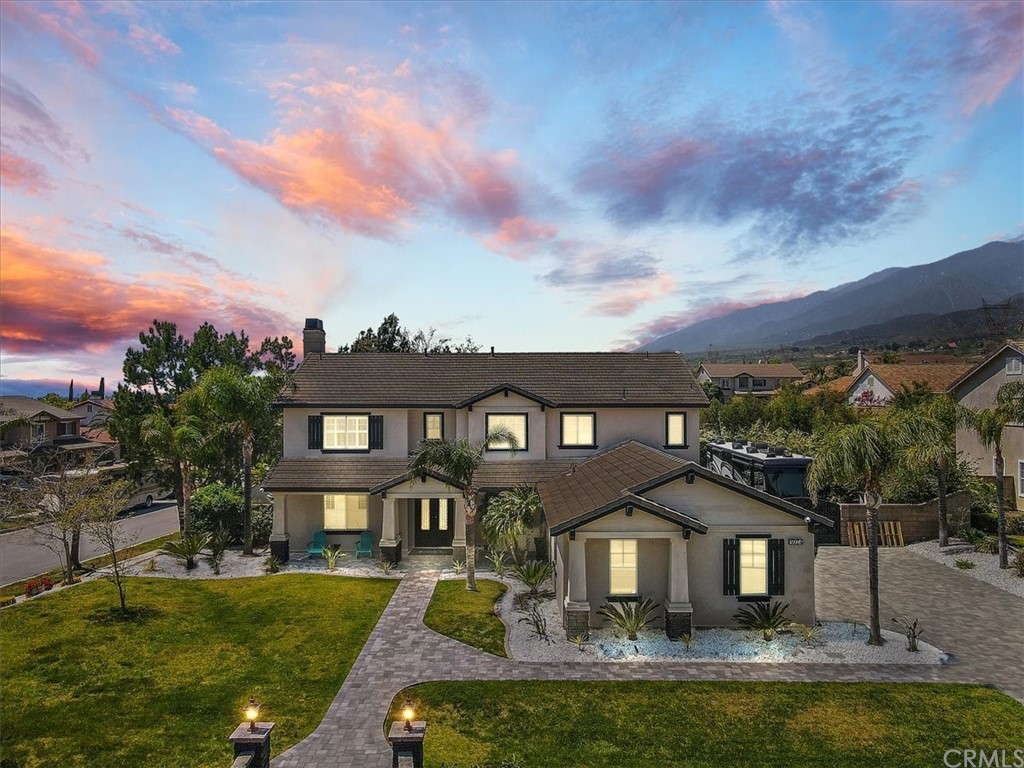 5024 Cervetti Avenue Rancho Cucamonga, CA 91739 - Photo 1 of 1 a front view of a house with garden