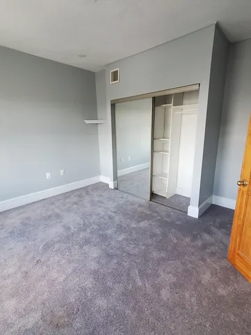 an empty room with a fireplace