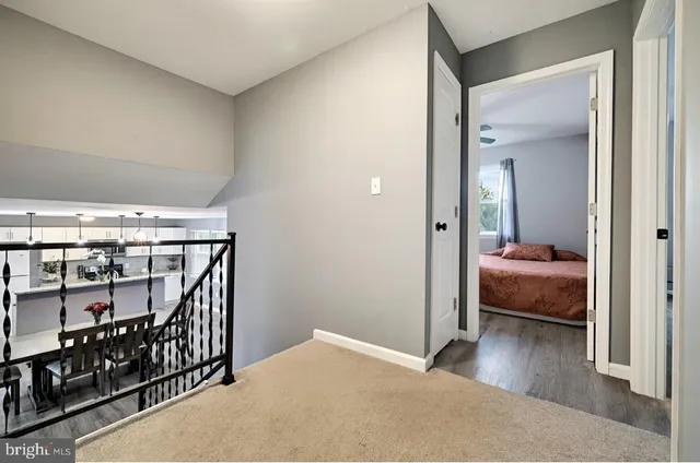 a bedroom with a bed and a view of bedroom