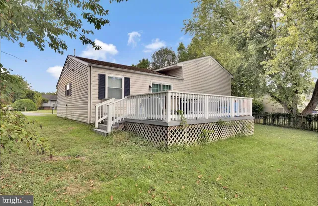 a view of a house with a fence
