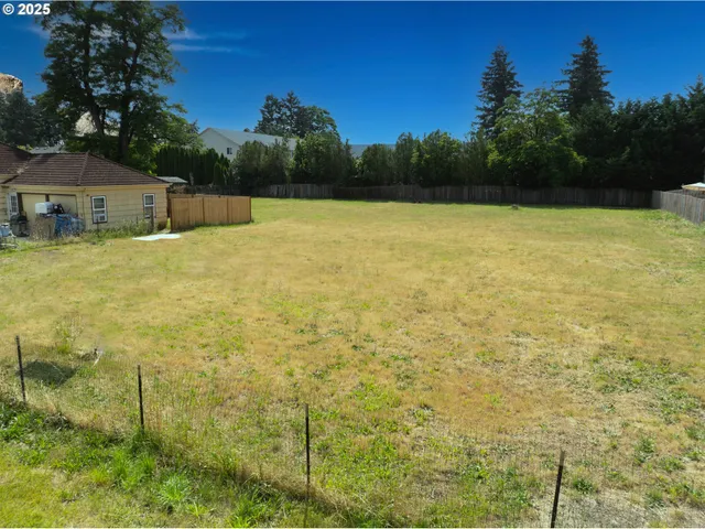 a view of lot of green space and trees