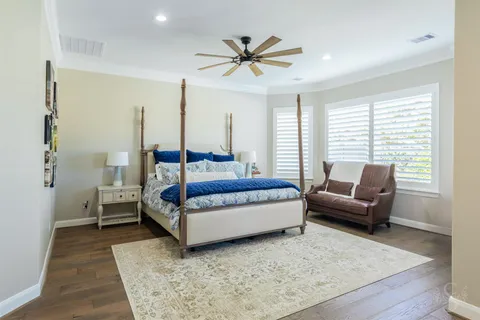 a bedroom with a bed and a couch