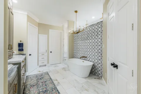 a bathroom with a bathtub and shower