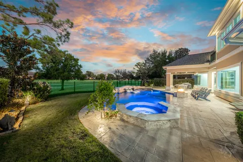 a view of a swimming pool with a yard