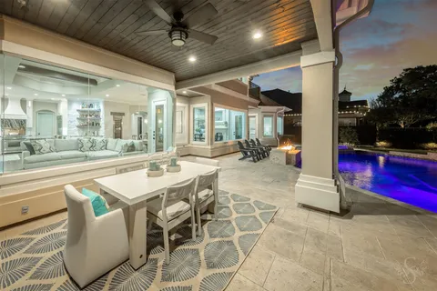a view of a dining room with furniture and chandelier or outdoor space