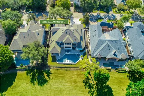 an aerial view of houses with yard