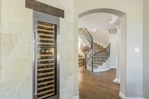 a view of wooden floor and windows