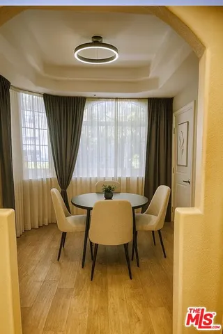 a view of a livingroom with furniture and windows